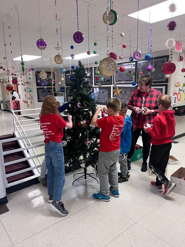 Webster’s Student Council decorating the tree to make the halls of Webster more festive! 