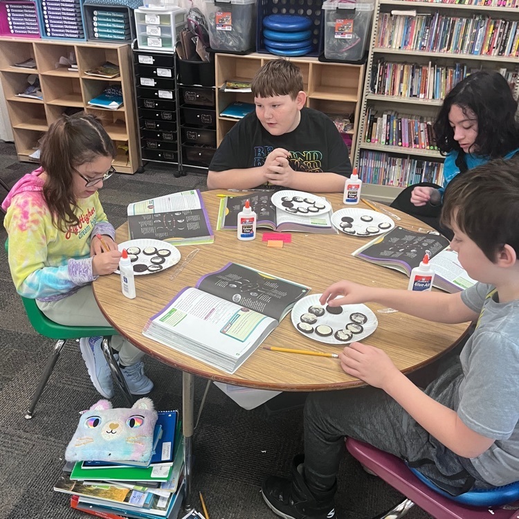 Webster 5th graders learning about the moon phases using Oreos!