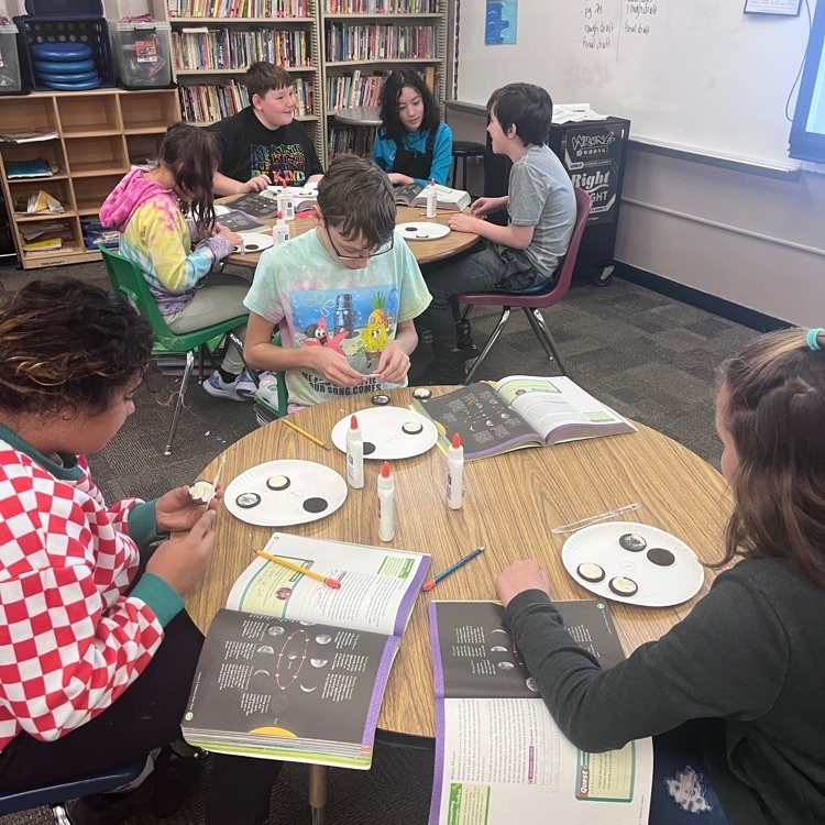 Webster 5th graders learning about the moon phases using Oreos!