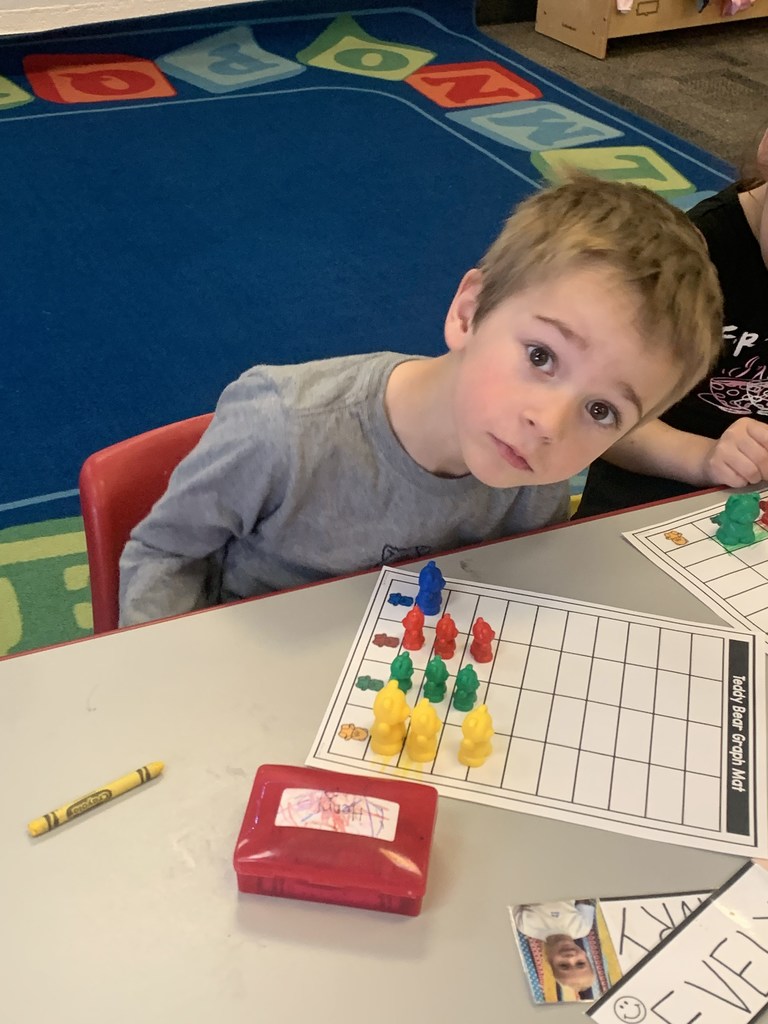 Webster preschoolers with Mr. Schmitz are busy learning about graphing and how to make bar graphs!