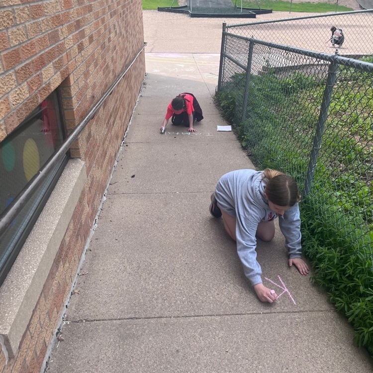Webster 5th graders publishing their poems using sidewalk chalk!