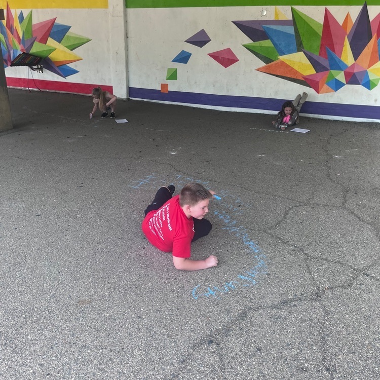 Webster 5th graders publishing their poems using sidewalk chalk!